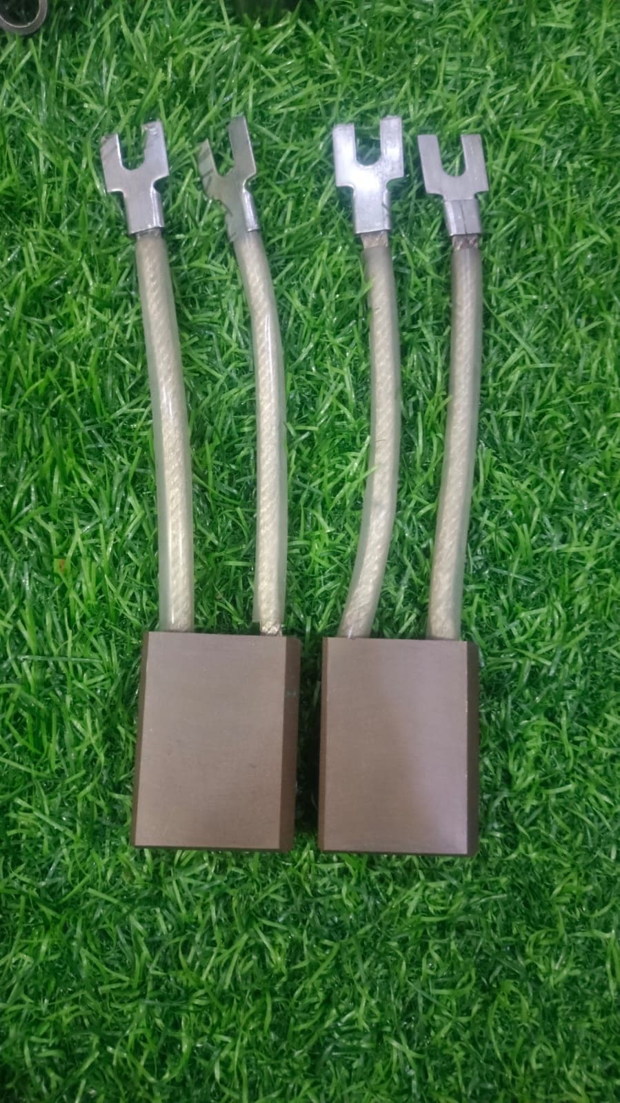 Pair of electro-graphite carbon brushes with twin leads and fork terminals from Heena Electric Corporation