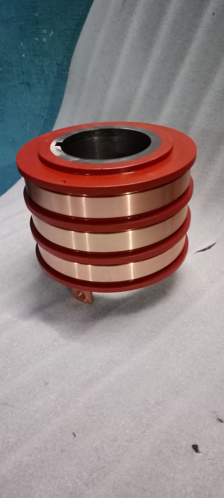 Orange insulated three-ring slip ring with keyed bore by Heena Electric Corporation