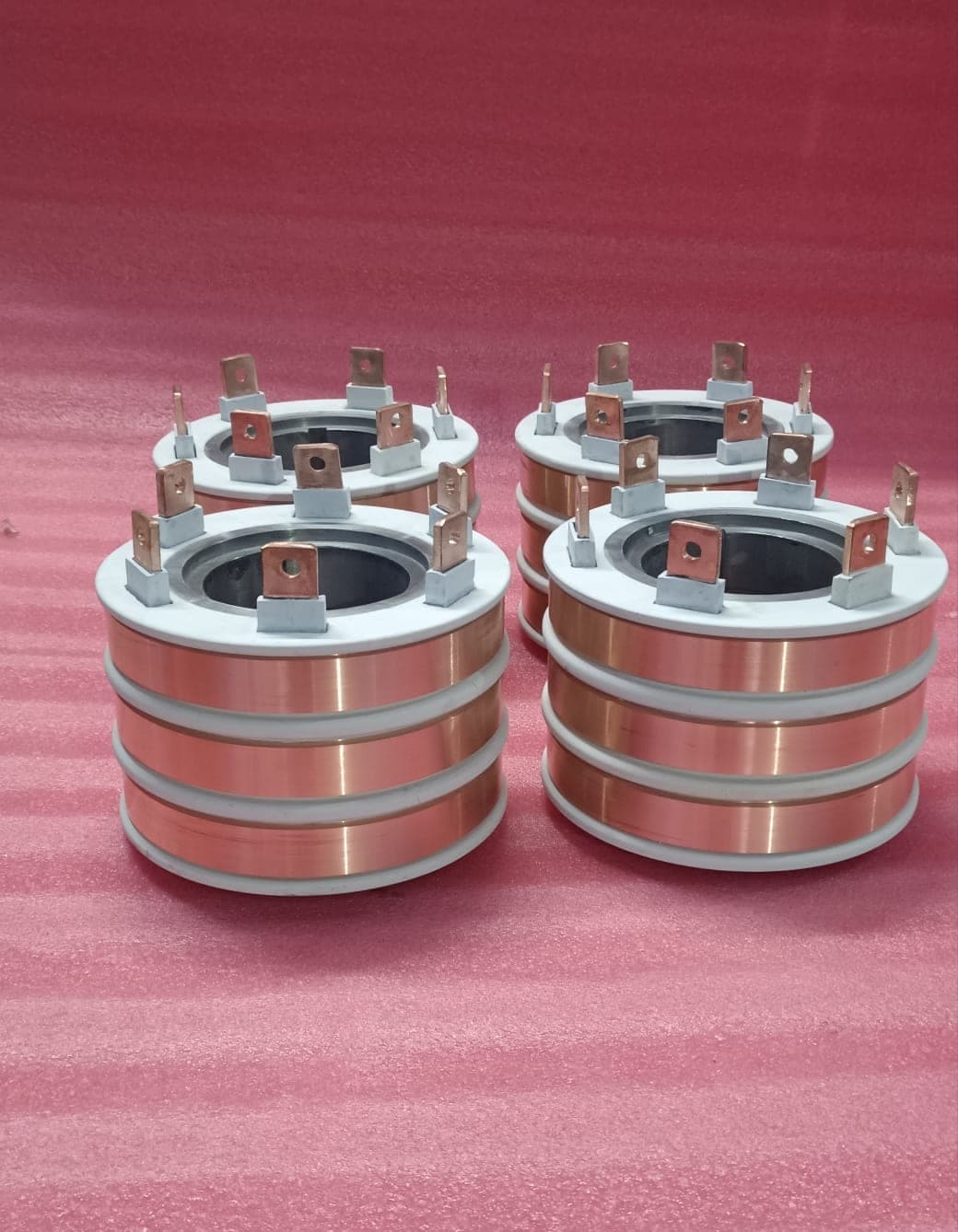 Batch of four copper slip ring assemblies manufactured by Heena Electric Corporation for industrial motors