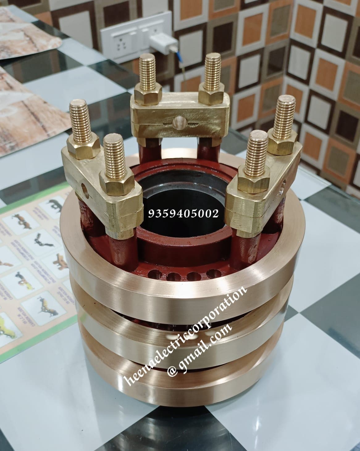 Slip ring unit with brass connection clamps and copper rings produced by Heena Electric Corporation