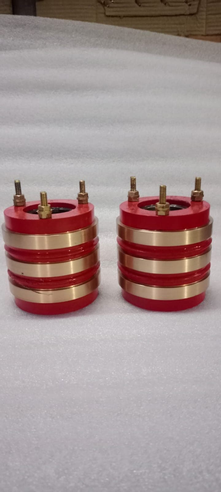 Pair of small brass three-ring slip rings manufactured by Heena Electric Corporation