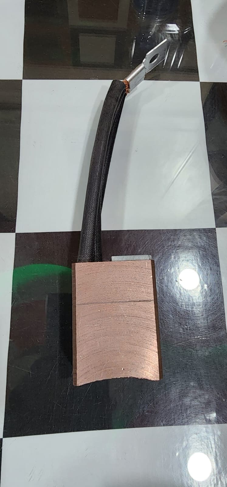 Copper metal-graphite carbon brush with braided lead manufactured by Heena Electric Corporation